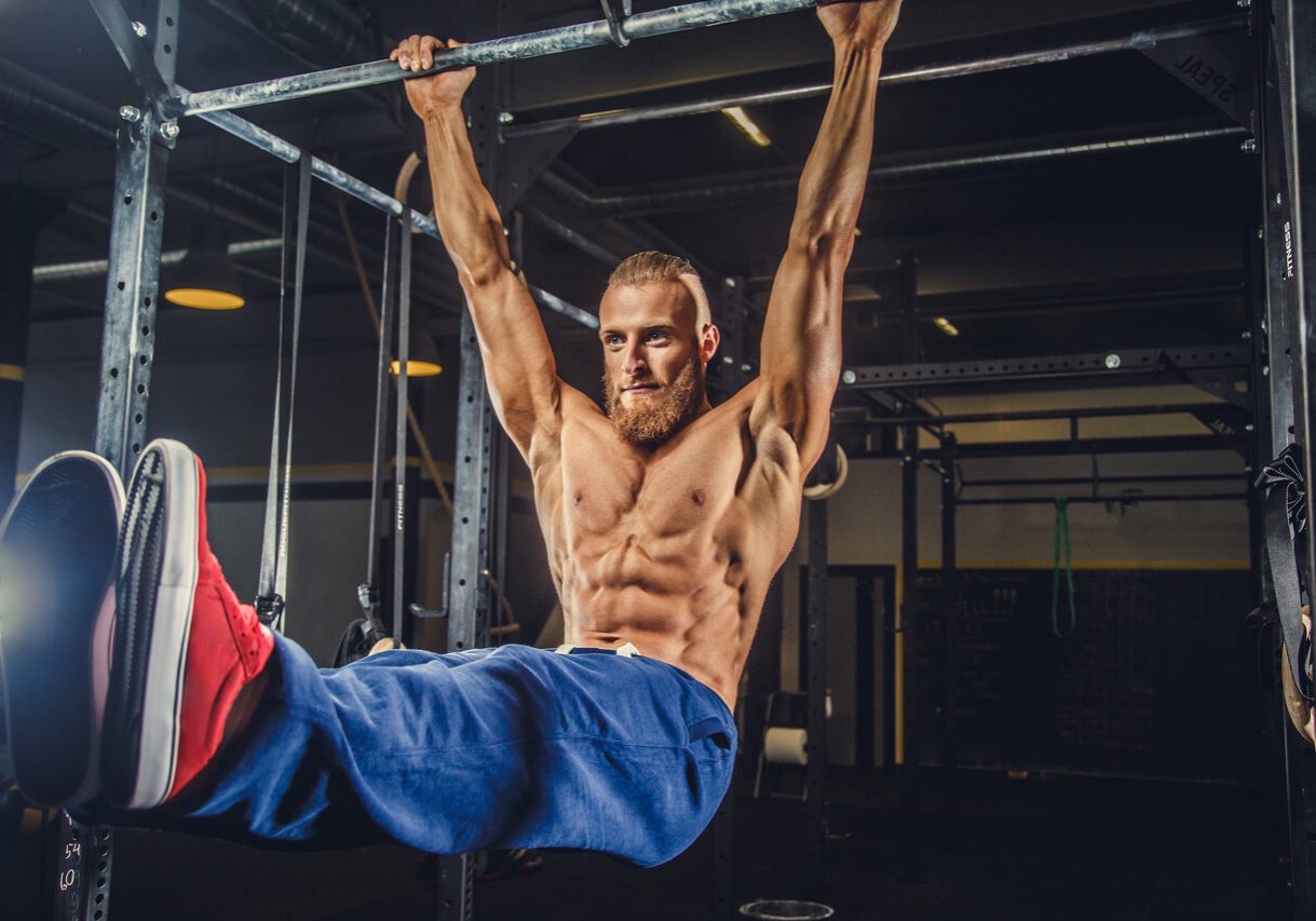 shirtless-muscular-bearded-male-doing-exercises-horizontal-bar-gym-club_Easy-Resize.com